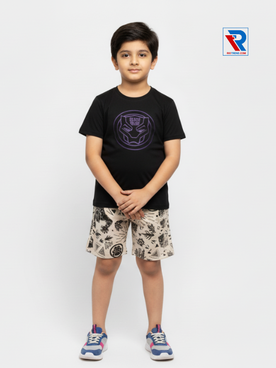 Boys clothing set 2–10 years black t‑shirt and cream shorts, folded arms pose Riotrend apparel.