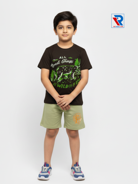 Boys clothing set 2–10 years black t‑shirt and light green shorts, folded arms pose Riotrend apparel.