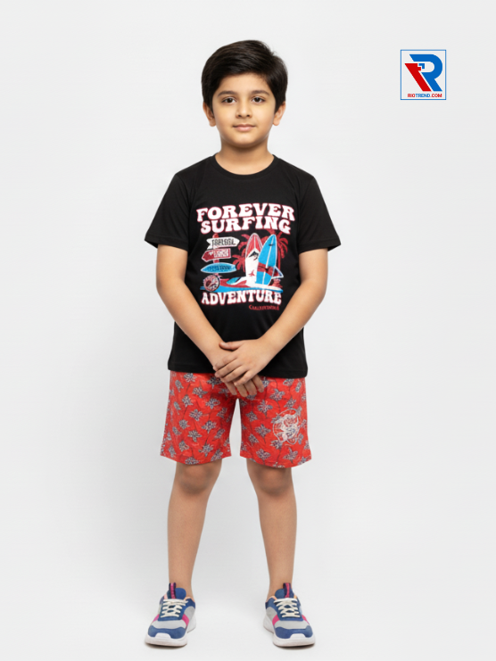 Boys clothing set 2–10 years black t‑shirt and scarlet shorts, folded arms pose Riotrend apparel.