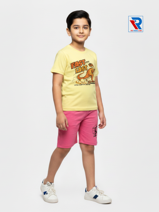 Boys clothing set 2–10 years with yellow t‑shirt and pink shorts, relaxed side view by Riotrend.