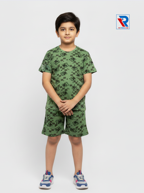 Boys’ camouflage green t-shirt and shorts set for ages 2–10 years, folded arms view – Riotrend stylish outfit.
