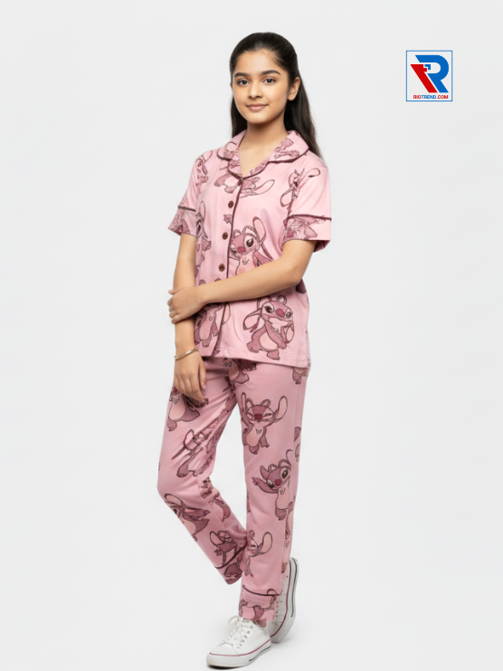 Girls night suit set, ages 7–12, black top and pyjama pants, folded‑leg and folded‑arms left view – RioTrend kids sleepwear showcasing a casual, confident pose.