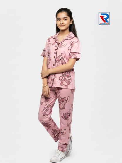 Girls night suit set, ages 7–12, black top and pyjama pants, folded‑leg and folded‑arms left view – RioTrend kids sleepwear showcasing a casual, confident pose.