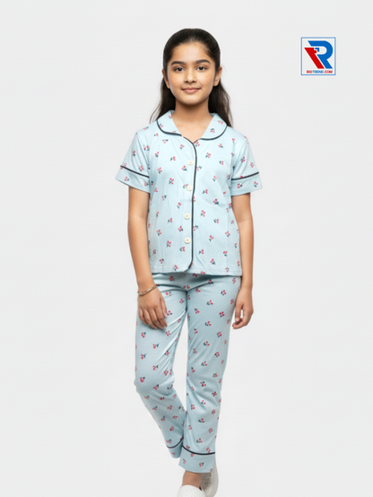 Girls night suit set, ages 7–12, charming dark stylish blue top and pyjama pants, folded‑leg view – RioTrend kids sleepwear showcasing a casual, relaxed pose.