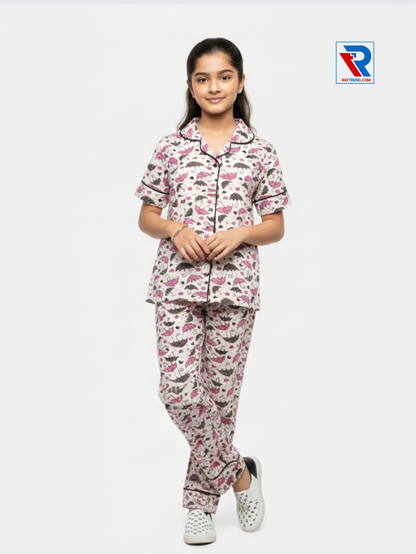 Girls night suit set, ages 7–12, cream top and pyjama pants, folded‑leg view – RioTrend kids sleepwear showcasing a casual, relaxed pose.