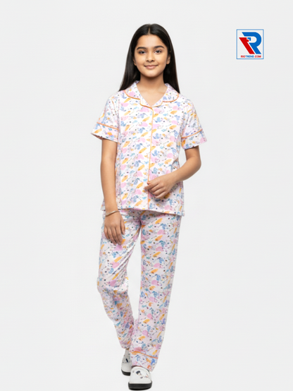 Girls night suit set, ages 7–12, elegant white top and pyjama pants, folded‑leg view – RioTrend kids sleepwear showcasing a casual, relaxed pose.