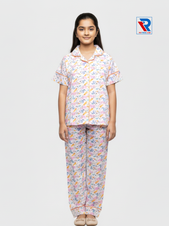 Girls night suit set, ages 7–12, elegant white top and pyjama pants, relaxed pose view – RioTrend kids sleepwear emphasizing everyday comfort and style.