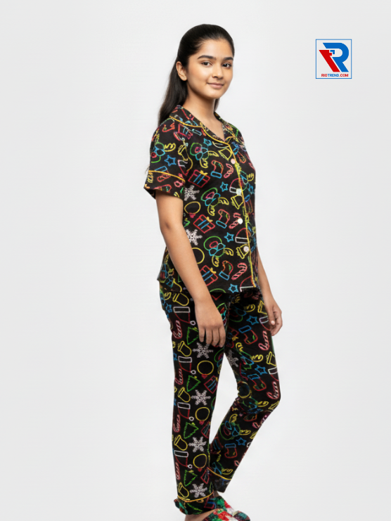 Girls night suit set, ages 7–12, black top and pyjama pants, relaxed pose right view – RioTrend kids sleepwear emphasizing everyday comfort and style.