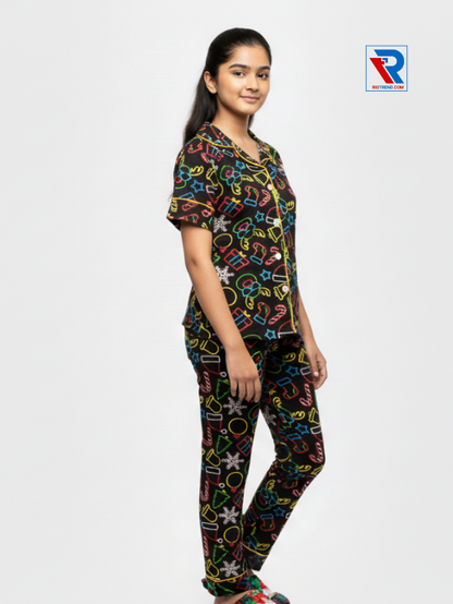 Girls night suit set, ages 7–12, black top and pyjama pants, relaxed pose right view – RioTrend kids sleepwear emphasizing everyday comfort and style.