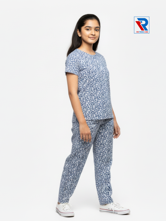 Girls pyjama set in blue color, ages 1–12, standing side view – RioTrend kids sleepwear emphasizing fit and comfort.
