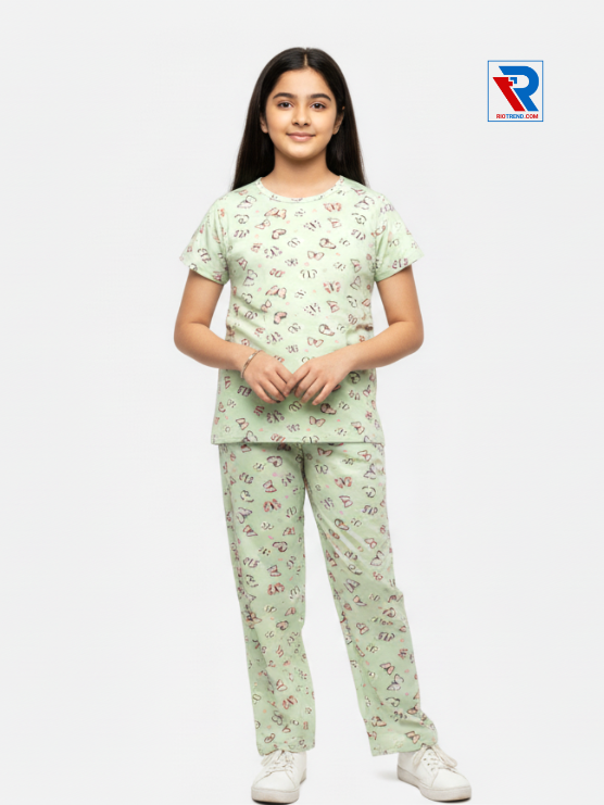 Girls pyjama set in light green color, ages 1–12, folded‑arms view – RioTrend kids sleepwear showcasing a casual, confident pose.