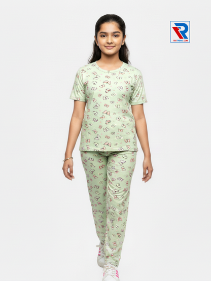 Girls pyjama set in light green color, ages 1–12, front view – RioTrend kids sleepwear highlighting design and comfort.