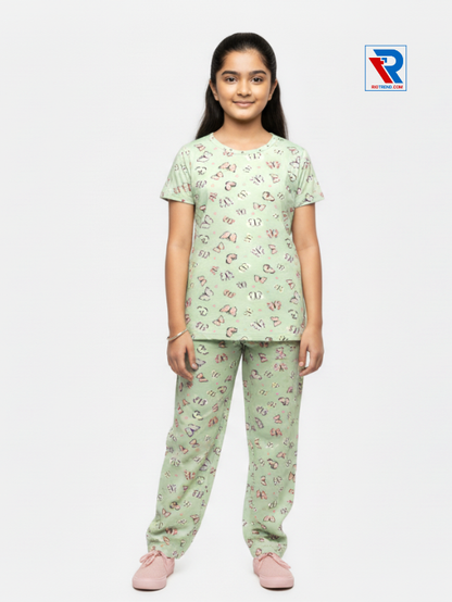 Girls pyjama set in light green color, ages 1–12, relaxed pose view – RioTrend kids sleepwear emphasizing everyday comfort and style.