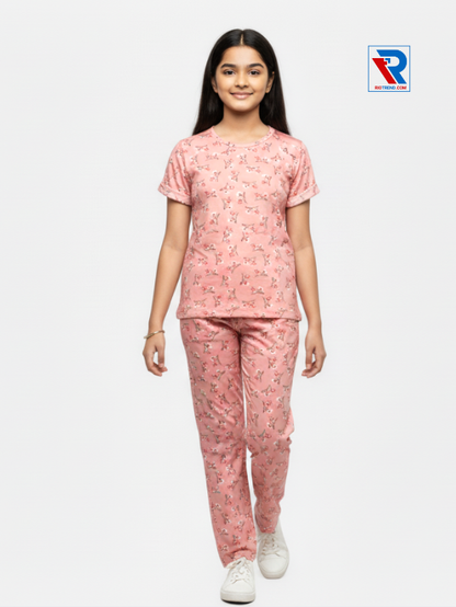 Girls pyjama set in pink color, ages 1–12, front view – RioTrend kids sleepwear highlighting design and comfort.