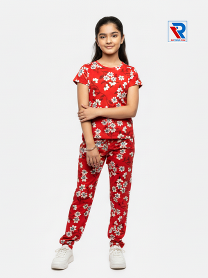Girls pyjama set in red color, ages 1–12, folded‑arms view – RioTrend kids sleepwear showcasing a casual, confident pose.