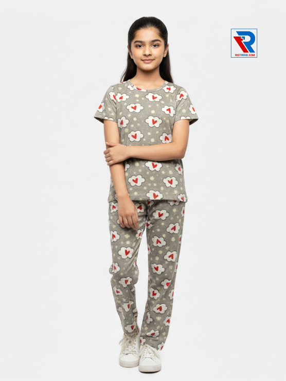 Girls pyjama set in tan color, ages 1–12, folded‑leg and folded‑arms view – RioTrend kids sleepwear highlighting a casual, confident pose.