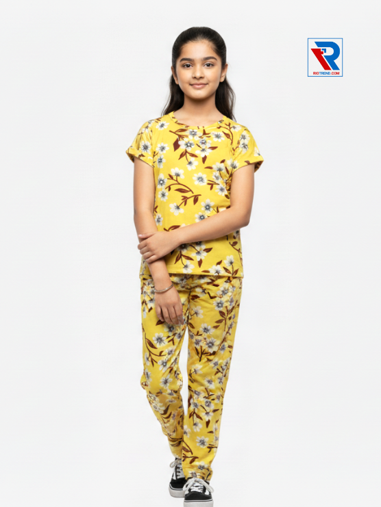 Girls pyjama set in yellow color, ages 1–12, folded‑leg and folded‑arms view – RioTrend kids sleepwear showcasing a casual, confident pose.