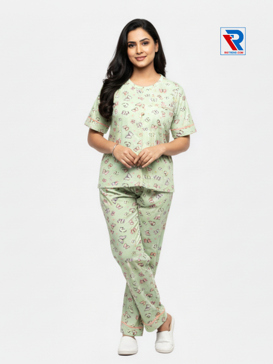 Women’s pyjama set, sizes M–XL, light green top and pyjama pants, folded‑leg arms view – RioTrend sleepwear showcasing a casual, relaxed pose.