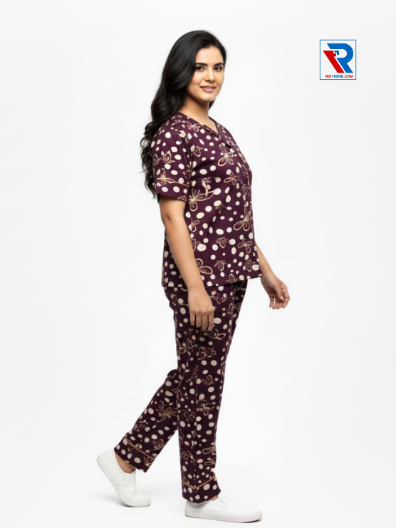 Women's pyjama set with maroon-green top and matching pants, sizes M-L-XL, shown in relaxed side view by Riotrend.
