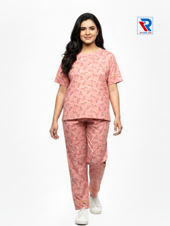 Women’s pyjama set, sizes M–XL, pink top and pyjama pants, front view – RioTrend sleepwear highlighting comfort and design.
