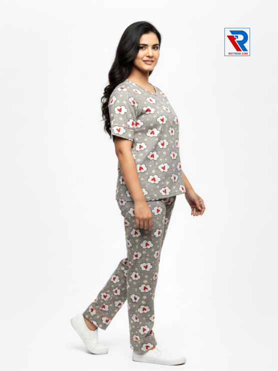 Women's pyjama set with tan-green top and matching pants, sizes M-L-XL, shown in relaxed side view by Riotrend.